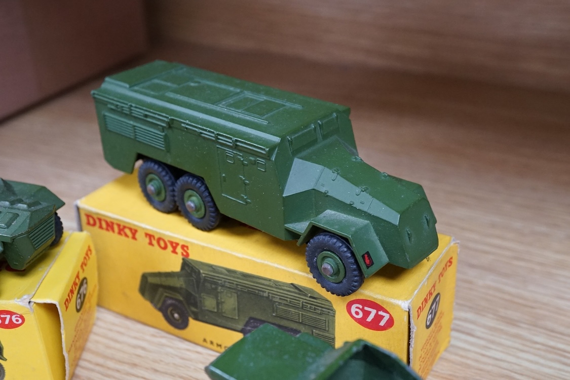 Nine boxed Dinky Toys military vehicles; Armoured Command Vehicle (677), Scout Car (673), Armoured Car (670), Army Water Tanker (643), Army 1-ton Cargo Truck (641), Armoured Personnel Carrier (676), Army Covered Wagon (6